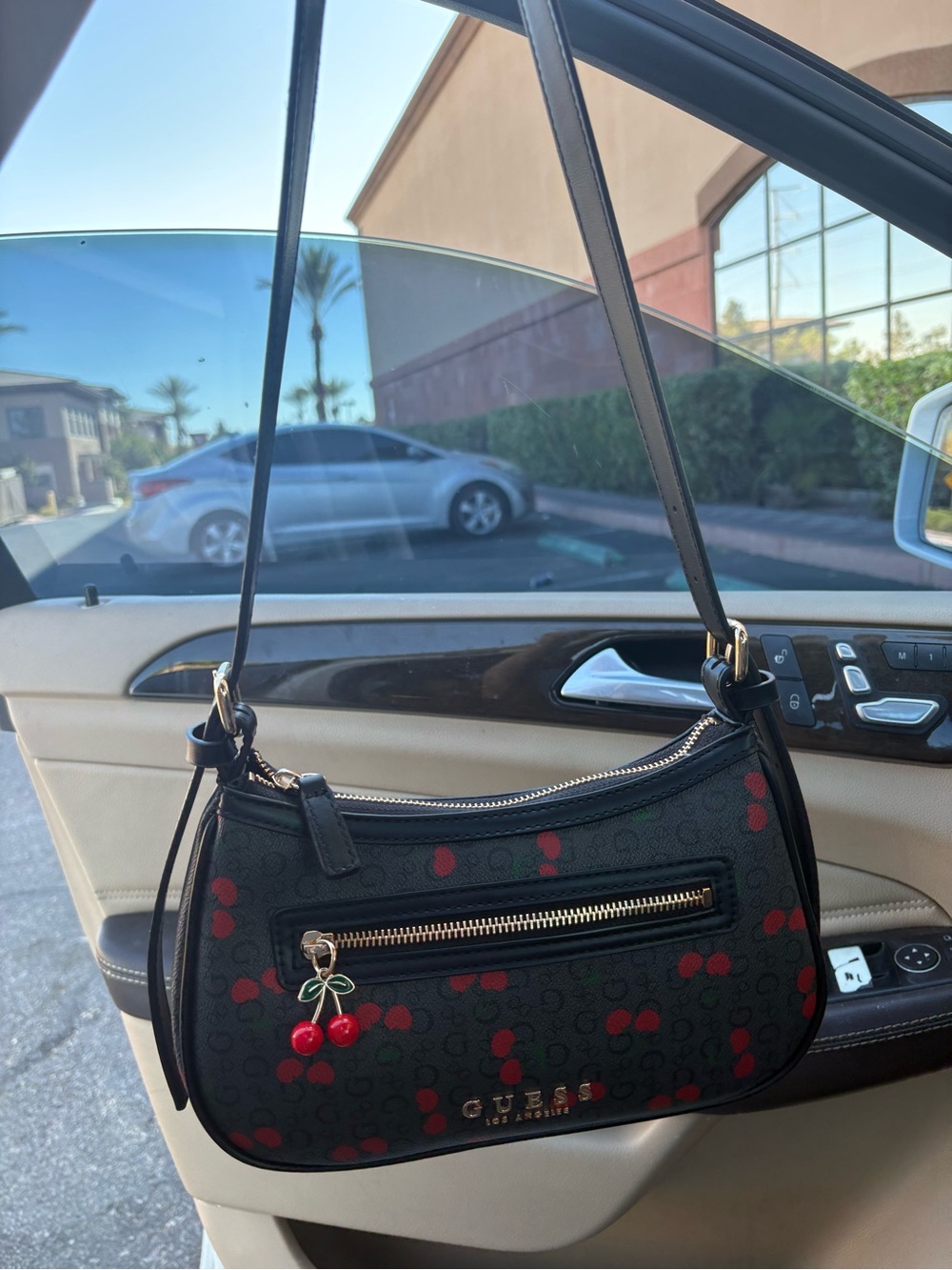 GUESS Black Shoulder Bag with Red Cherry Motif